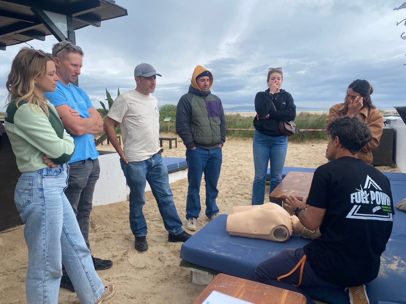Workshop participants learning CPR with a training mannequin